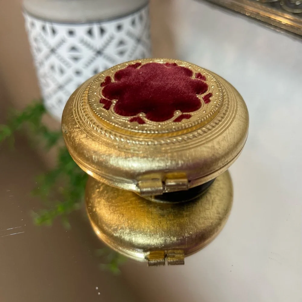 Vintage Revlon “Love Pat” Gold-tone Powder Compact with Burgundy Velvet Accent.